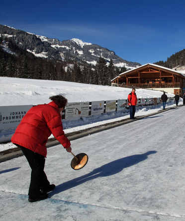 Traditional ice stock sport as a winter activity in Grossarl